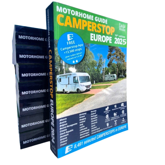 Stack of 'Motorhome Guide Camperstop Europe' books with a cover showing camper parking.